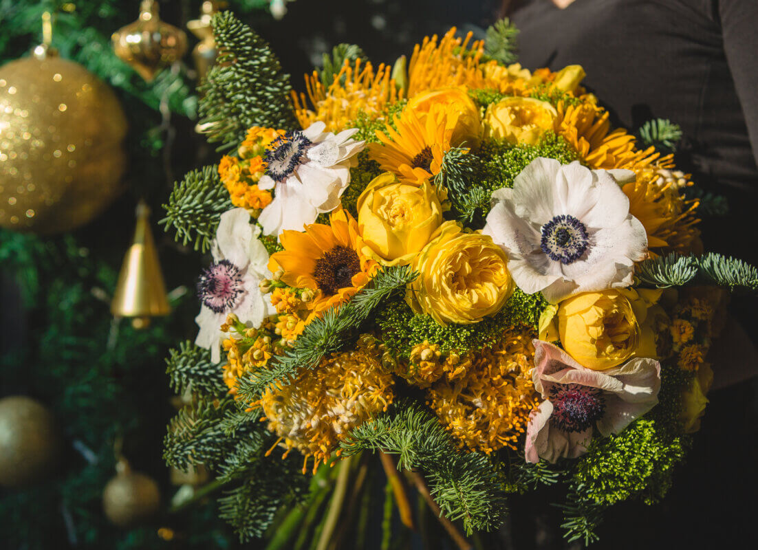 marigold bouquet with golden christmas ornaments