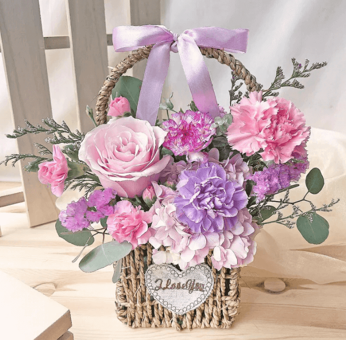 beautifully arranged flower basket by Simply Blooms